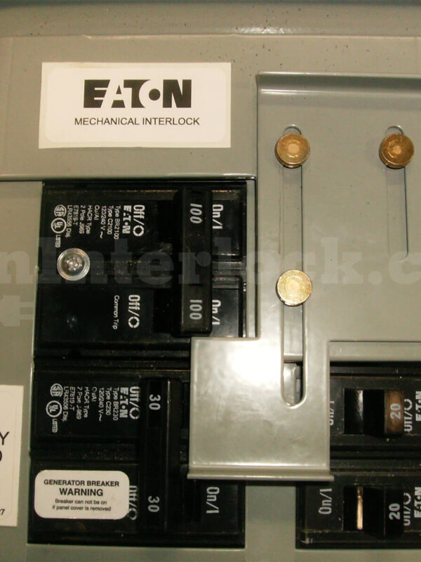 Eaton Cutler-Hammer 21602 Generator Interlock Kit Installed on Panel Showing Eaton Mechanical Interlock Label