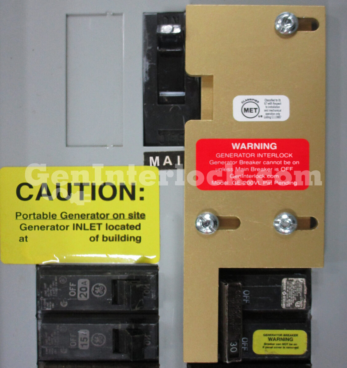 GE 31206 Generator Interlock Kit Installed on Breaker Panel with Caution Labels