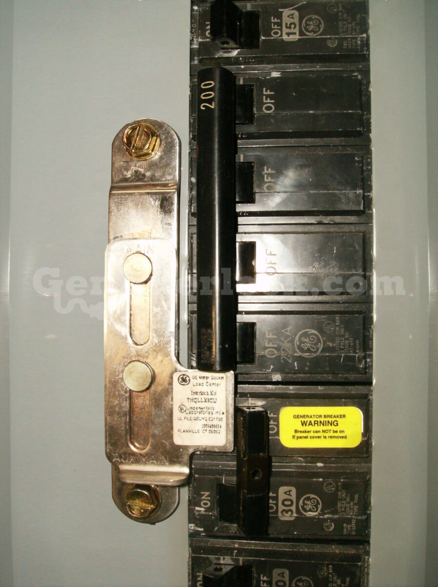 GE 31603 Meter Main Generator Interlock Kit (formerly GE200S) - Installed on Panel Showing MAIN and AUX MAIN Labels