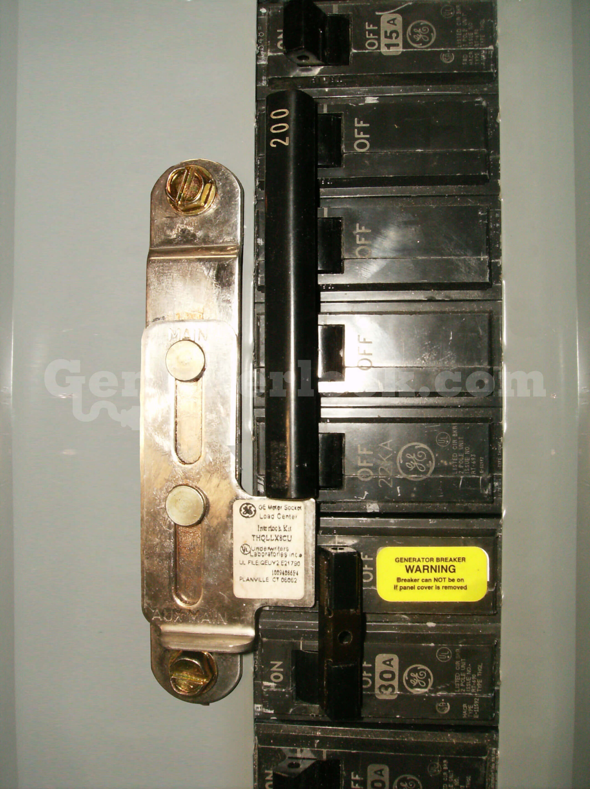 GE 31603 Meter Main Generator Interlock Kit (formerly GE200S) - Installed on Panel Showing MAIN and AUX MAIN Labels
