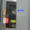 Square D Homeline 51202 Meter Main Generator Interlock Kit - Installed on Panel Showing Service Disconnect Label