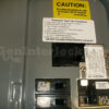 Square D Homeline 51601 Generator Interlock Kit Installed on Breaker Panel with Caution Labels